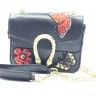 Butterfly bag black, complete with long chain handle.